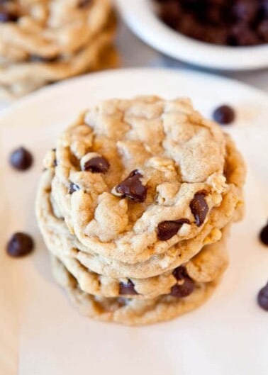 A stack of chocolate chip cookies on a plate.