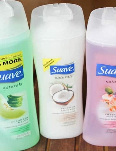 Three bottles of suave naturals shampoo in different scents.