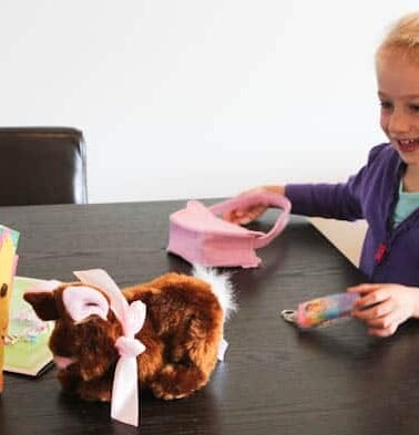 Skylar smiling with easter themed presents