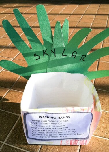 A handwashing awareness craft with a paper hand labeled "skylar" and information about the importance of handwashing to prevent germ spread.