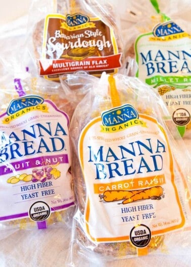 Assortment of manna organics bread varieties on a countertop.