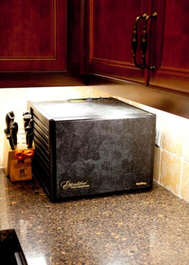 A bread maker appliance on a kitchen countertop.