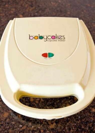 A babycakes cupcake maker appliance on a countertop.