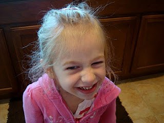 Young girl smiling in kitchen