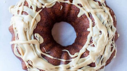 Glazed bundt cake on white paper.