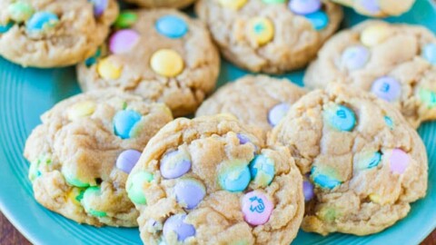 A plate of homemade cookies with colorful candy pieces mixed in.