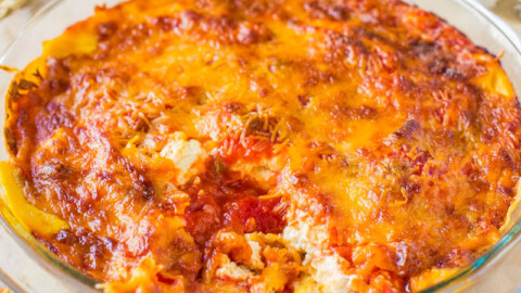 A baked lasagna in a glass dish with a golden-brown cheese crust.