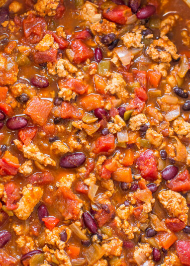 A pot of hearty chili with ground meat, beans, and tomatoes.