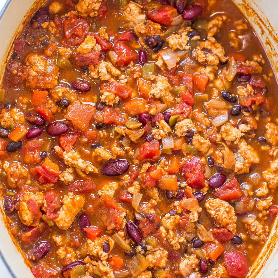 A pot of hearty chili with ground meat, beans, and tomatoes.