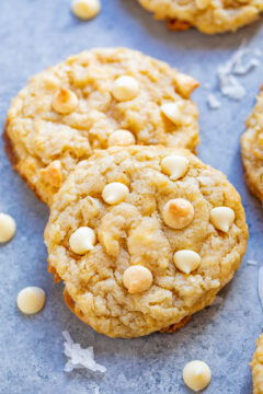 Coconut White Chocolate Cookies - Soft, chewy, and so moist thanks to the coconut and browned butter with the PERFECT amount of white chocolate!! If you like white chocolate, you will LOVE these spring and summery-tasting EASY cookies!!