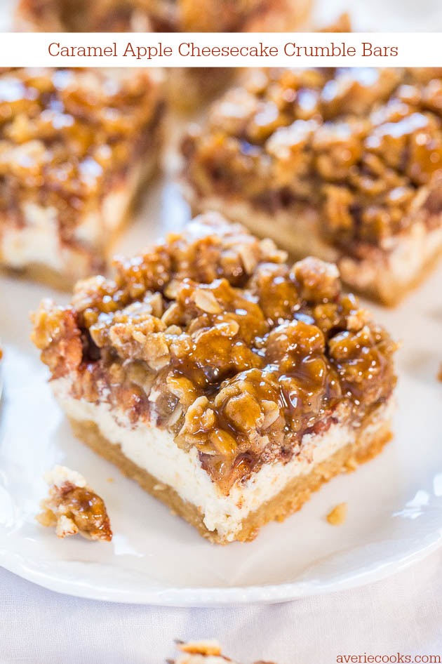 A close-up shot of caramel apple cheesecake crumble bars on a white plate. The bars have a crumbly topping and a creamy cheesecake layer. Text in the image reads "Caramel Apple Cheesecake Crumble Bars.