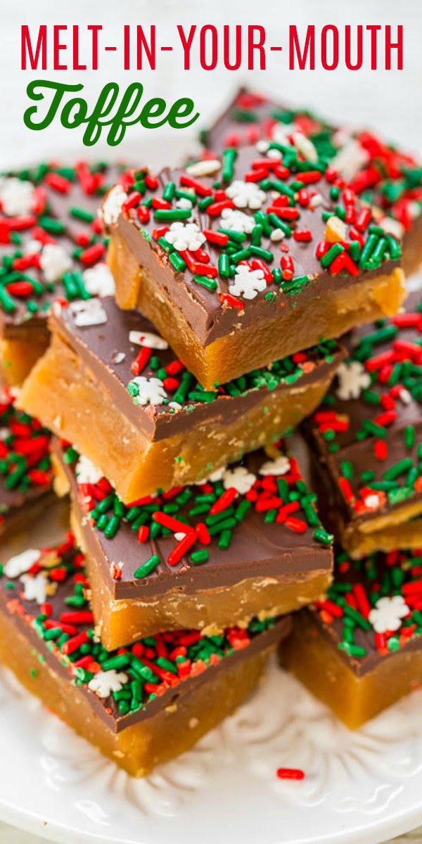 A stack of chocolate-covered toffee squares topped with red, white, and green sprinkles and snowflake decorations.