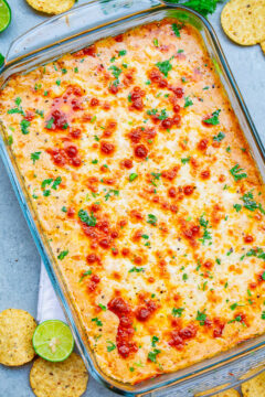 Mexican Baked Cheesy Street Corn Dip - A hot corn dip reminiscent of Mexican street corn!! Creamy, cheesy, spiked with lime juice, chili powder, and a serrano chile or jalapeno for a touch of heat! SO EASY and ready in 20 minutes!! Perfect for parties, potlucks, tailgating, or your next FIESTA!! 