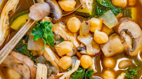 Chicken Vegetable Soup with Garbanzo Beans - Healthy yet hearty and ready in 30 minutes, this EASY chicken soup is perfect for chilly weather! Complete with juicy shredded chicken, mushrooms, tender garbanzo beans, zucchini and kale for a green pop in this noodle-free family favorite! 