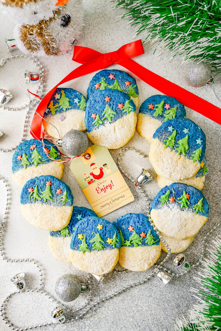 Christmas Shortbread Cookies - Jazz up typical Christmas shortbread cookies with these two-toned, soft and buttery shortbread cookies! They have fun and festive star-shaped sprinkles and are decorated with white chocolate Christmas trees making them perfect for holiday entertaining and cookie exchanges. They look impressive, but are easy enough for beginning bakers! 