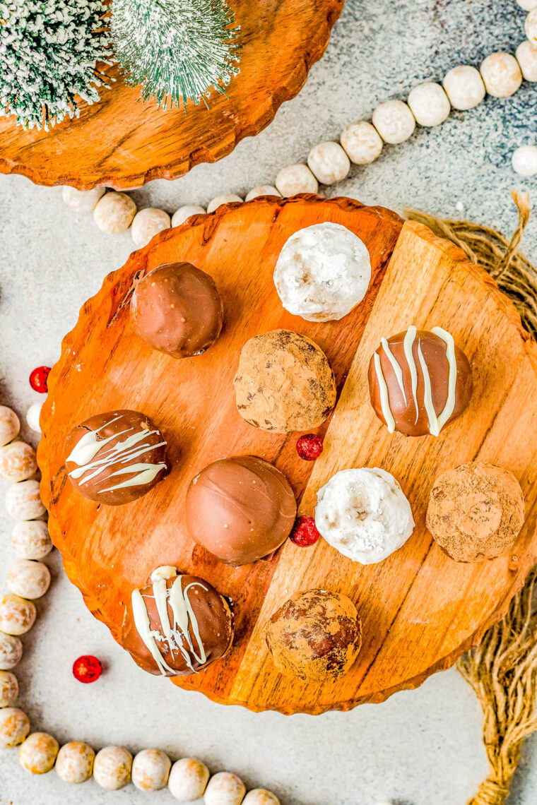 Rum Balls - A classic rum balls recipe made with crushed ginger snaps cookies, toasted pecans, melted butter, and spiced rum! Roll these FAST and EASY NO-BAKE treats in confectioners' sugar, cocoa powder, coconut, or dip them in melted chocolate! Great for gift-giving and cookie exchanges because you can make them far in advance! 