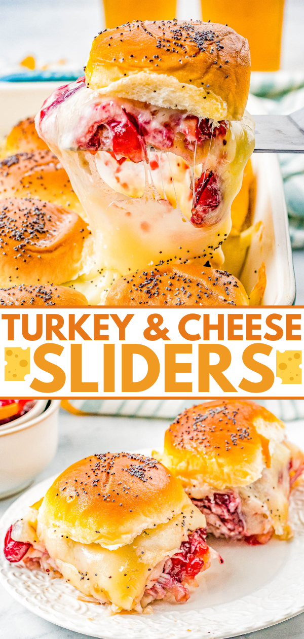 Two turkey and cheese sliders with poppy seeds, one being lifted from a baking dish, revealing melted cheese and sliced tomatoes.