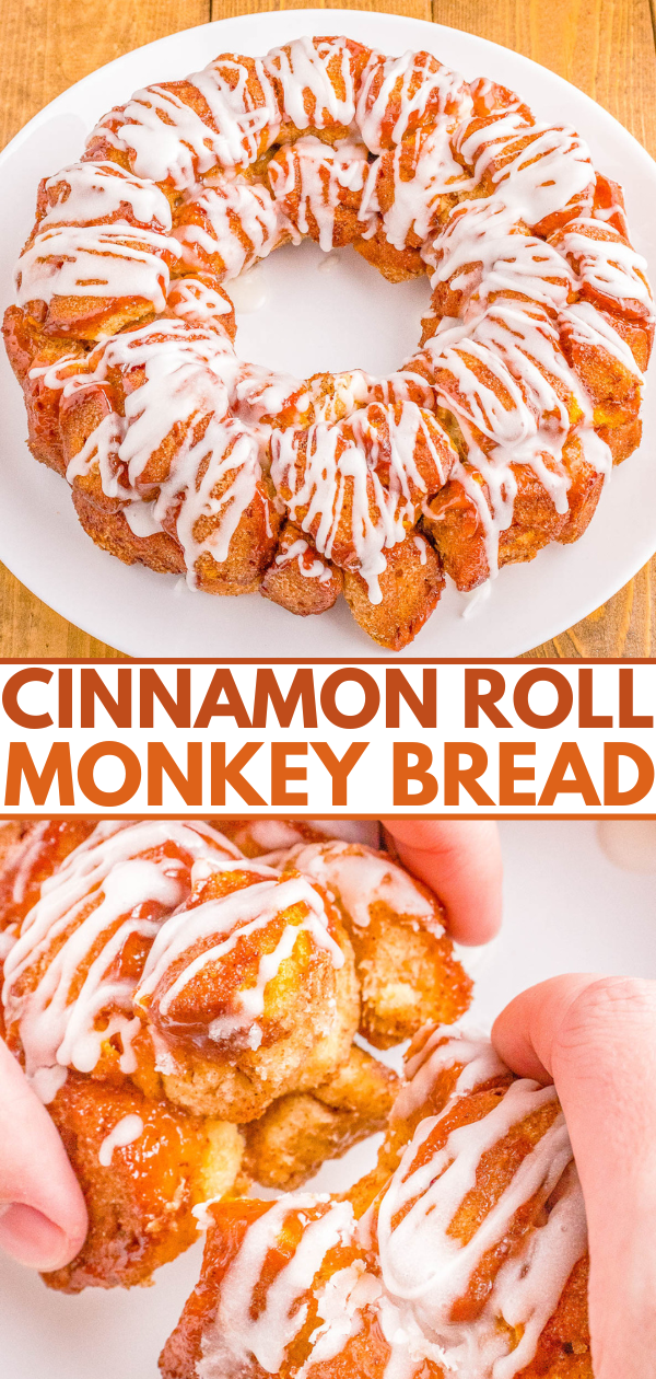 A cinnamon roll monkey bread topped with white icing, displayed on a white plate with a hand pulling apart a piece.
