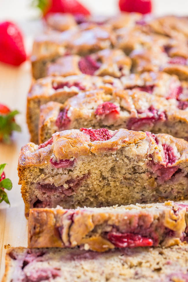The Best Strawberry Banana Bread sliced on a wooden table