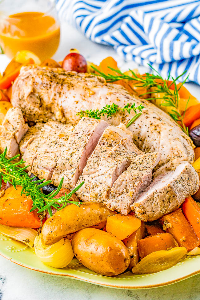 Slow Cooker Pork Loin - Tender, juicy pork loin is slow cooked with hearty vegetables for a complete and EASY meal! Reminiscent of a hearty and rustic recipe, yet fancy enough for a special dinner or holiday entertaining!