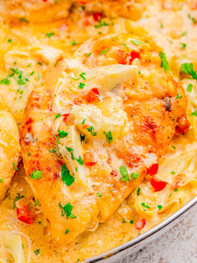 Creamy Parmesan Lemon Chicken Skillet - 🧀🍋🙌🏻 A decadent tasting yet FAST and EASY chicken skillet recipe that's sure to impress your family and friends! Tender lemony chicken, onions, red bell peppers, artichoke hearts, and melted Parmesan cheese with a rich cream sauce for a winner of a chicken dinner! Made in ONE skillet, ready in 30 minutes, and the perfect recipe to jazz up chicken breasts on busy weeknights!