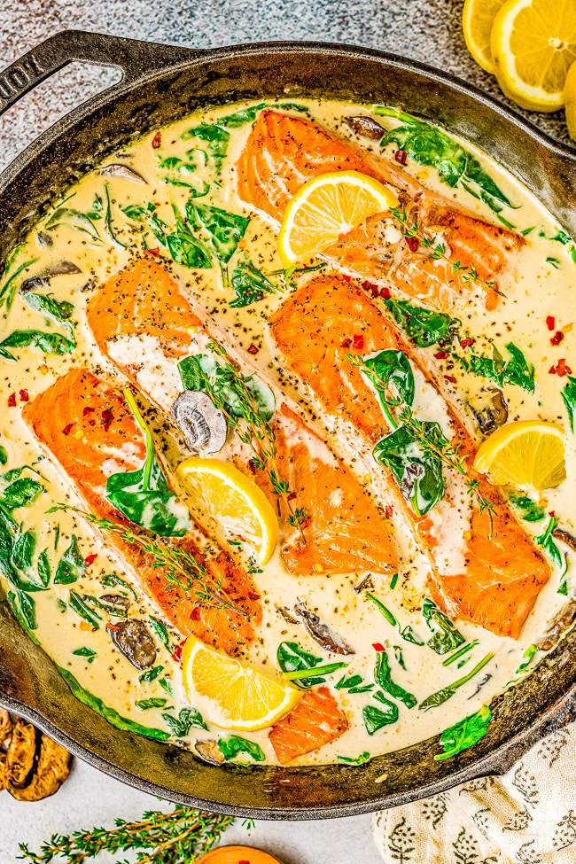 Salmon Florentine - You don't need to go to Florence, Italy to enjoy this FAST and EASY Italian-inspired salmon recipe at home! Tender flaky salmon is bathed in a decadent cream sauce made with heavy cream, wine, Parmesan cheese, and more! Fresh spinach and mushrooms add extra texture and flavor to this super flavorful fish dish!