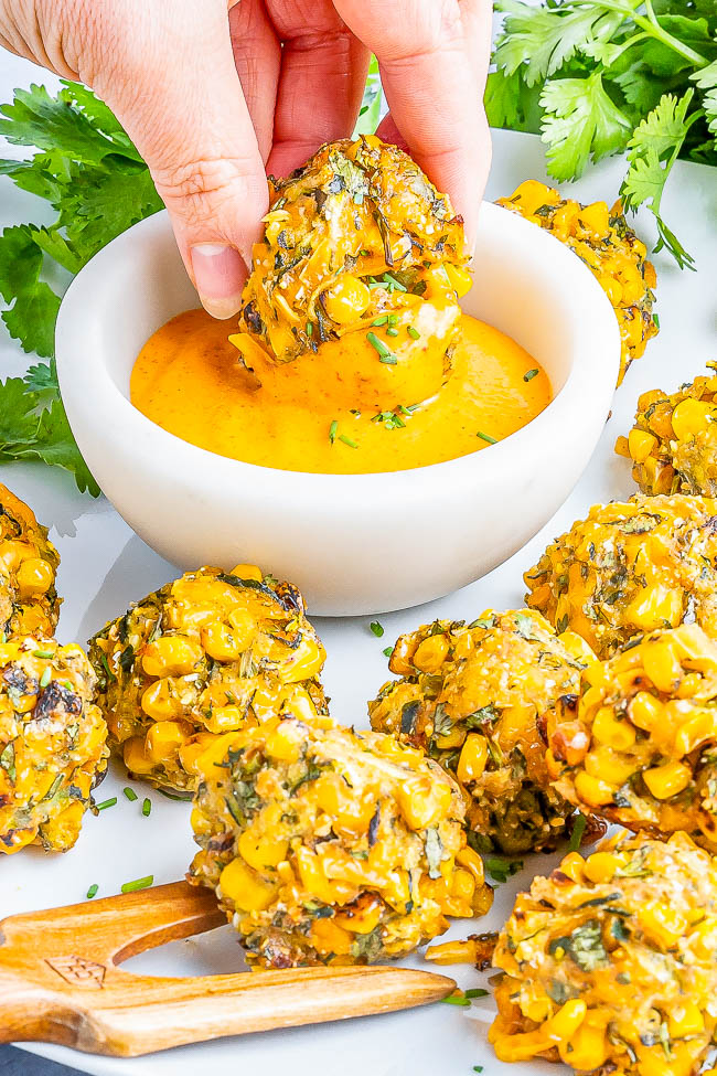 Baked Zucchini Corn Poppers - Celebrating the flavors of summer in these EASY poppers that are slightly crispy on the outside and soft on the inside! Layered with flavor thanks to not only zucchini and corn, but also shredded cheese, fresh herbs and spices, and serrano chili for a kick making you want to pop just one more! Air fryer instructions as well as vegan and gluten-free options provided. 