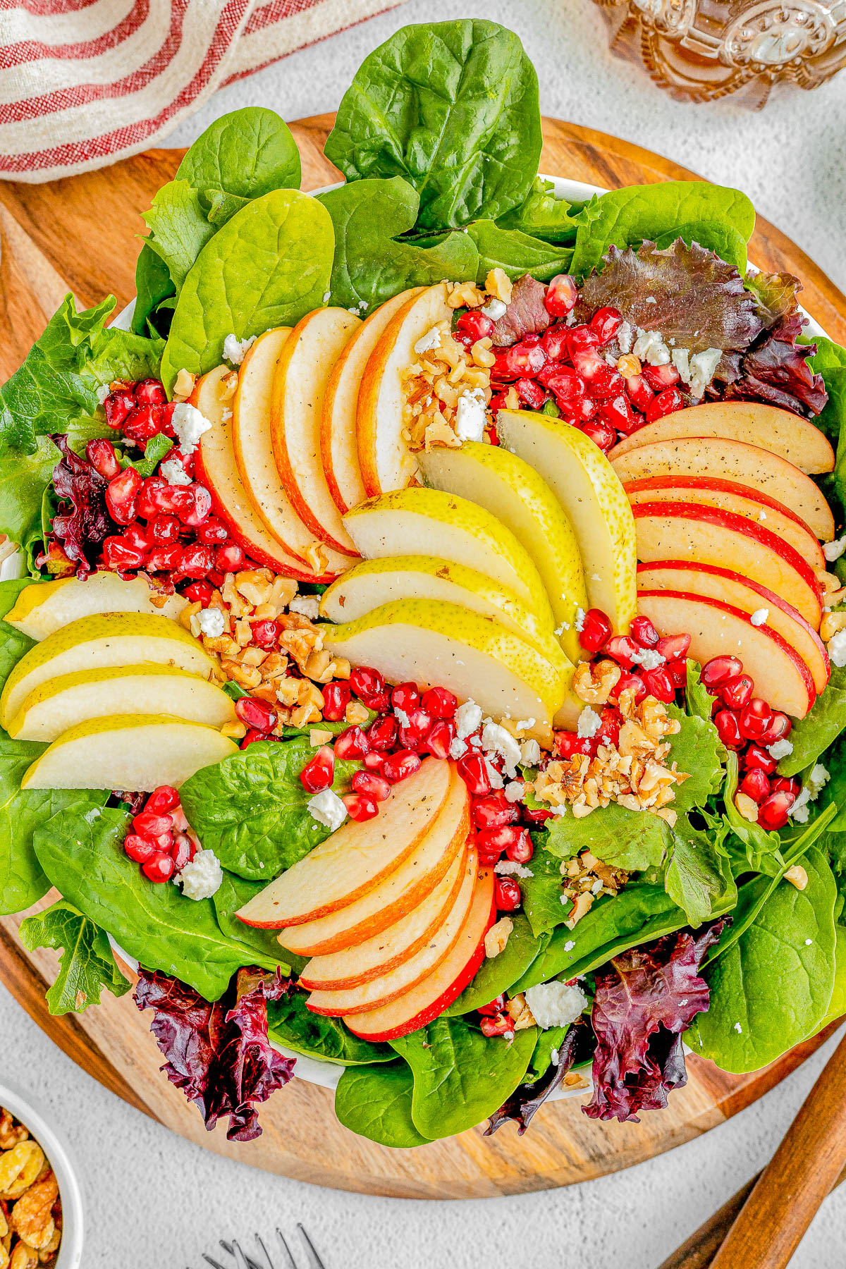 Apple and Pear Salad with Balsamic Vinaigrette - Complete with crisp apples, tender juicy pears, pomegranate seeds, nuts, crumbled feta, and a tangy homemade honey maple balsamic vinaigrette! Whether you're looking for a quick lunch idea, dinner side, or a holiday side dish for Thanksgiving or Christmas, this FAST and EASY salad is sure to get rave reviews!