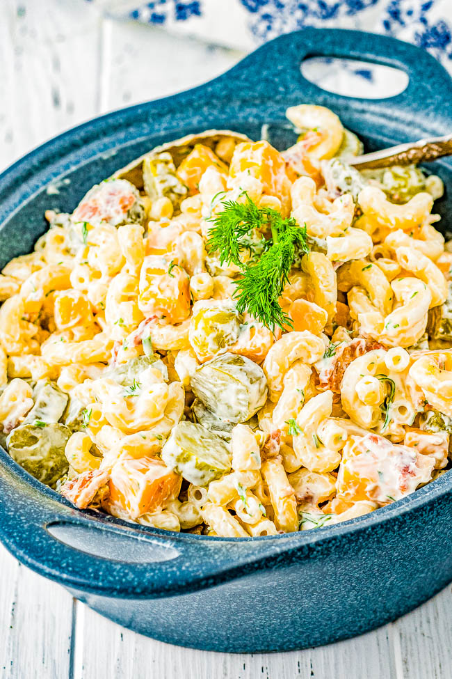 Dill Pickle Pasta Salad - Calling all pickle fans, you're going to love this creamy pasta salad with crunchy dill pickles in every bite! Along with cubes of cheese and crumbled bacon, this pasta salad will be the star of your next picnic, potluck, barbecue, or summer holiday! FAST, EASY, and IRRESISTIBLE! 