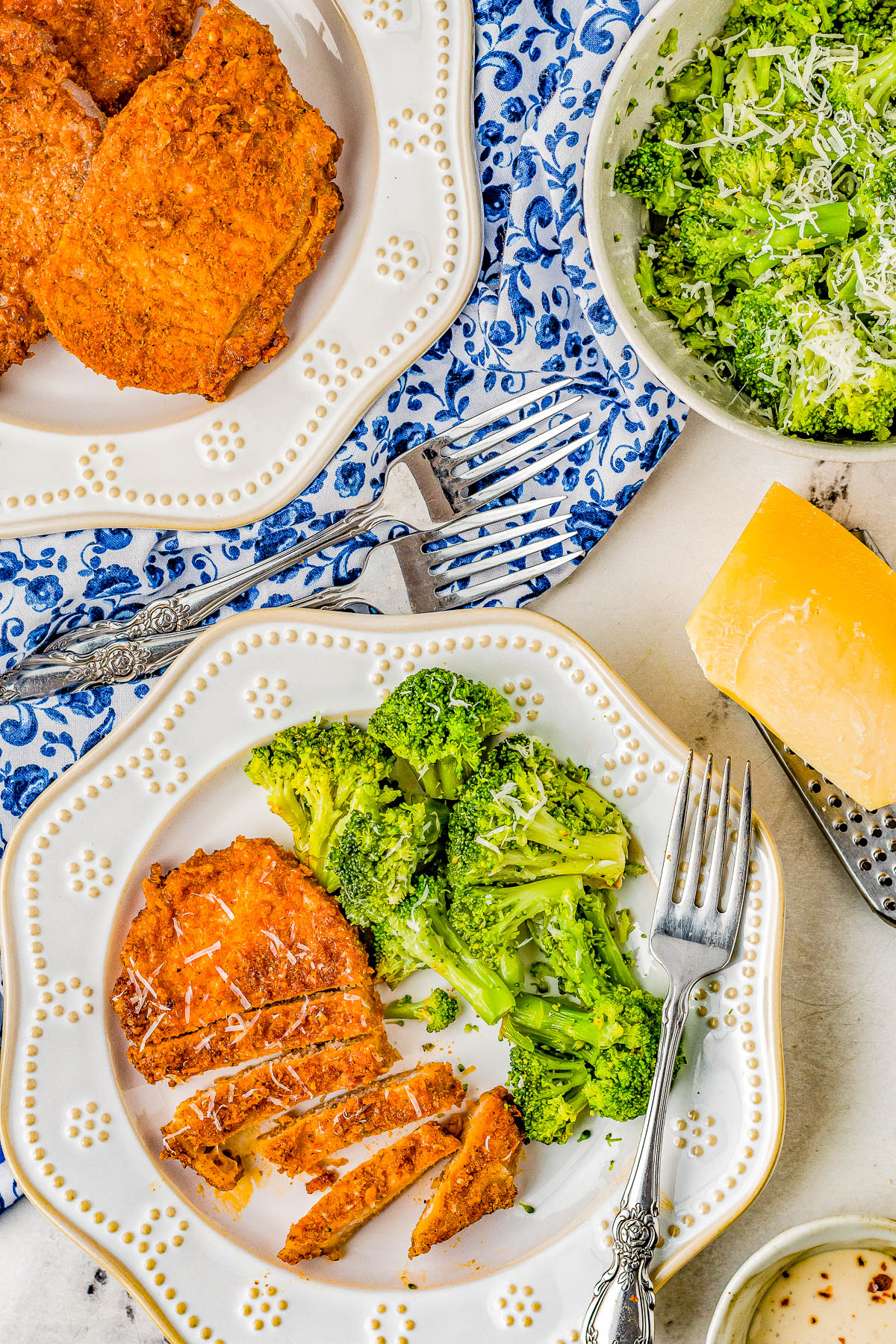 Air Fryer Pork Chops - Coated in Parmesan cheese and a rich spice rub, these air fried pork chops are perfectly crispy on the outside while staying tender and moist on the inside! They're EASY, ready in 15 minutes, perfect for busy weeknights, and a healthier way to enjoy "fried" food. Oven-baking and grilling instructions also provided.