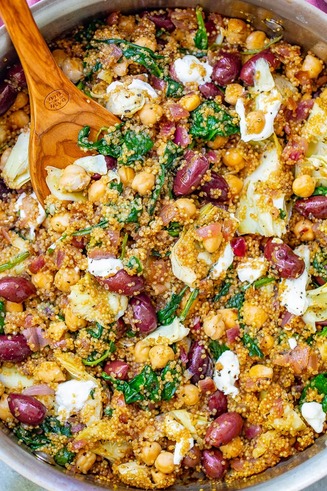 Mediterranean Quinoa Salad — This EASY quinoa salad is ready in 20 minutes with Mediterranean-inspired ingredients including chickpeas, Kalamata olives, artichokes, and goat cheese to give layers of flavor and texture in every bite! Naturally gluten-free and vegetarian!