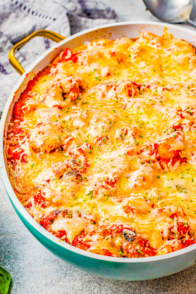 Cheesy Gnocchi and Meatballs — True Italian comfort food with these beef and pork homemade meatballs along with pillowy gnocchi. Everything is covered in homemade tomato sauce , smothered with cheese, and baked! Easier than it looks, and an instant family favorite that everyone will beg you to make again!