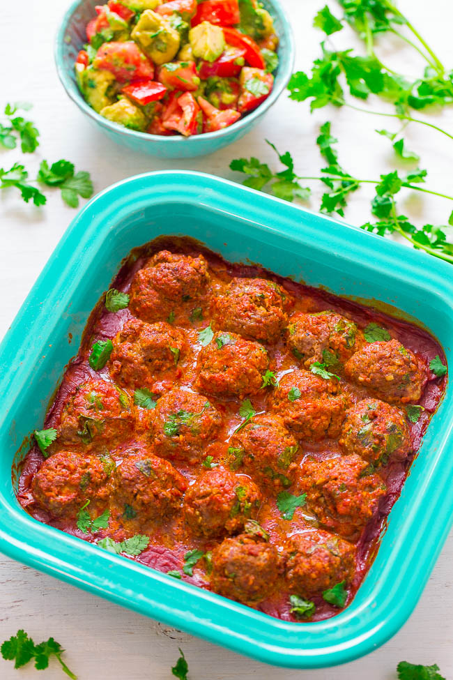 Mexican Beef Meatballs with Tomato Avocado Salad - These FAST and EASY beef meatballs are packed with protein that can provide strength to fuel the whole family. They’re coated in enchilada sauce and are loaded with Mexican-inspired flavors!! Great for busy weeknight dinners or easy-breezy entertaining!! #BeefItsWhatsForDinner #NicelyDone 