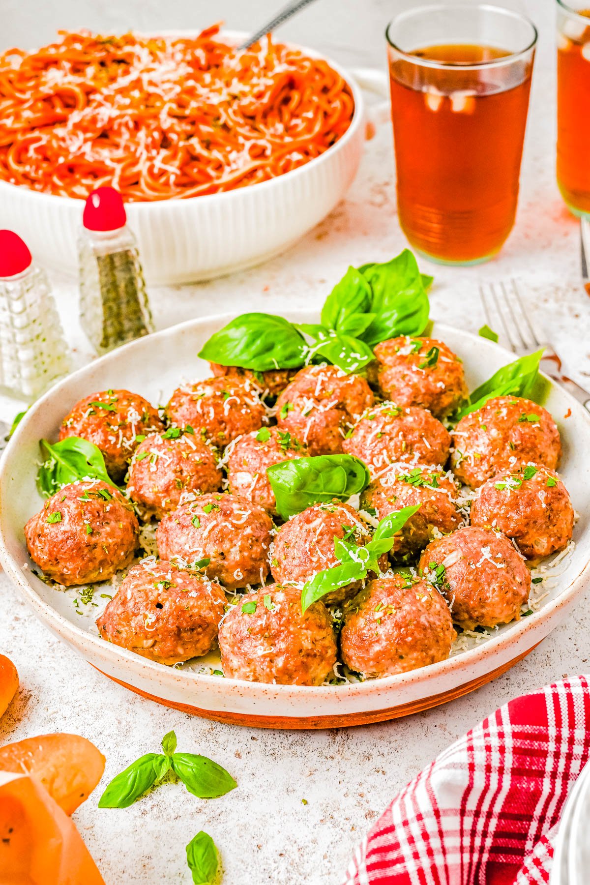 Baked Italian Meatballs — Ready in just 30 minutes, these quick and EASY baked meatballs come out perfectly moist and tender every time! There’s no need to brown the meatballs before baking, which cuts back on dishes and saves time! These are the BEST Italian meatballs for spaghetti, subs, casseroles, and more! 