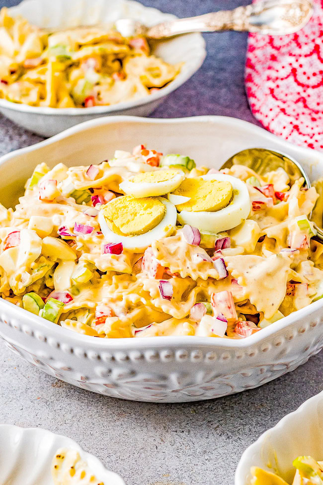 Amish Pasta Salad - A family-favorite classic pasta salad recipe with al dente pasta, bell peppers, celery, red onions, and hard-boiled eggs tossed in a creamy tangy-sweet dressing! Perfect for picnics, potlucks, backyard parties, and events! Everyone will go back for a second helping of this comforting side salad! 