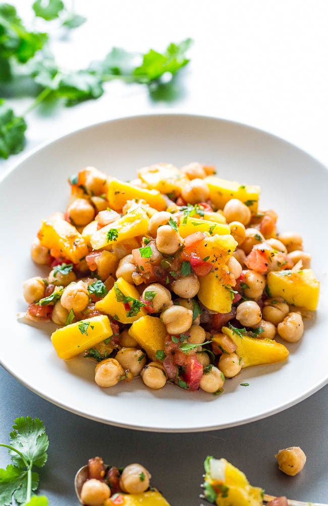 Tropical Chickpea Salad - Pineapple, mango, pineapple salsa, and pico de gallo tossed with chickpeas for a salad that tastes like a tropical vacation!! Easy, ready in 5 minutes, loaded with sweet-yet-savory flavor, and so healthy!!