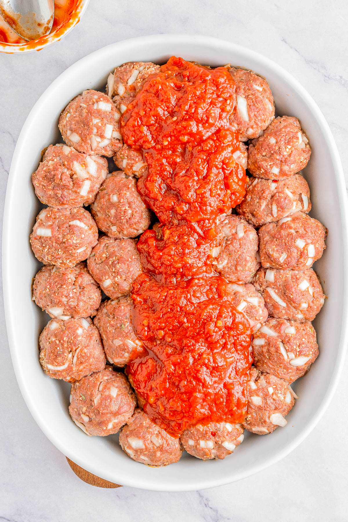 Cheesy Meatball Casserole - 🧀🎉👏🏻 An EASY comfort food casserole that's made for meat and cheese lovers! Loaded with juicy baked meatballs and topped with both mozzarella and Parmesan cheeses for a true family FAVORITE casserole! No noodles, no problem. My homemade meatballs are incredible but you can use frozen meatballs to save time on busy weeknights when you need to get dinner on the table in 45 minutes!