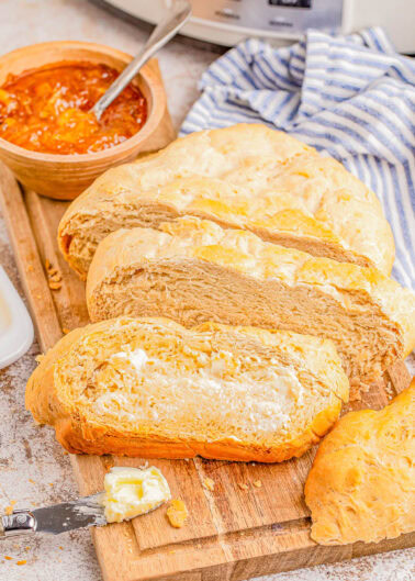 Slow Cooker Bread - 🍞🙌🏻💛 Learn how to make yeast bread in your Crock-Pot in less than 2 hours! Knead it briefly once, place the dough in your slow cooker, and let it do all the work! This is the EASIEST loaf of homemade bread you'll ever make! It has a crunchy crust with a soft and chewy center and is lovely toasted, as sandwich bread, or use it like you'd use French bread to sop up pasta sauce or dunk into soup.