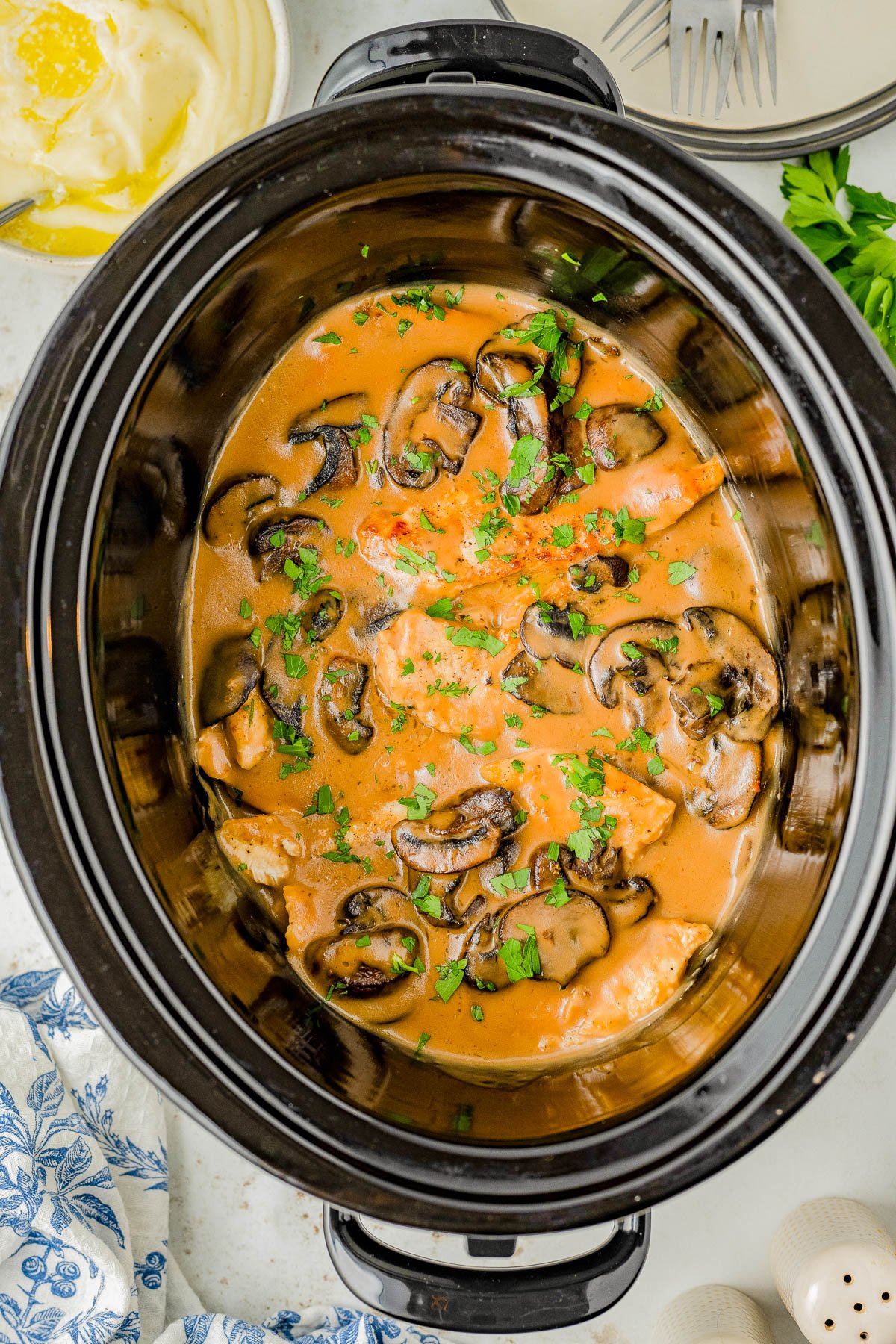 Slow Cooker Chicken Marsala – This classic comfort food recipe is complete with tender chicken breasts that are slow cooked with mushrooms and herbs in a flavorful creamy Marsala wine sauce! The rich sauce makes the perfect gravy served over rice or potatoes. Learn to make this restaurant quality dish at home in your Crock-Pot so that it's EASY enough for weeknight dinners!